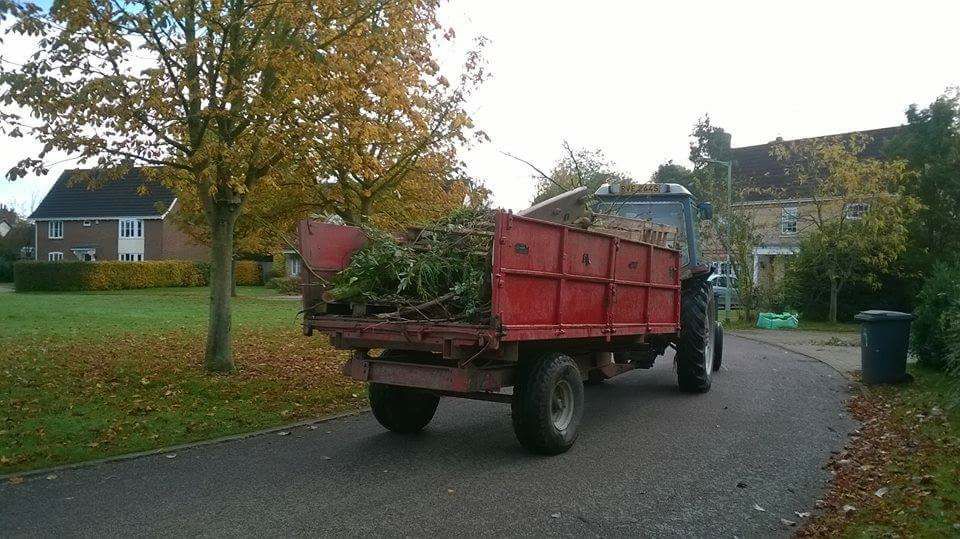 collecting firewood in tractor in Fox Green