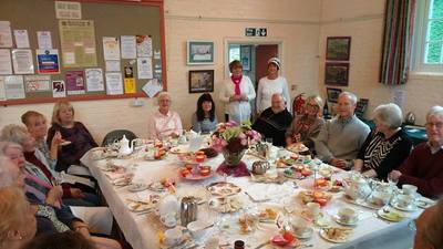 people sat round a table dressed for afternoon tea- part 1