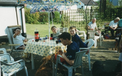 boys sitting round garden table