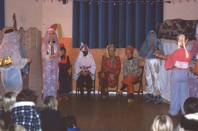 actors in 'arabian dress' in village hall