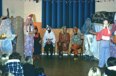 actors on the stage in the village hall