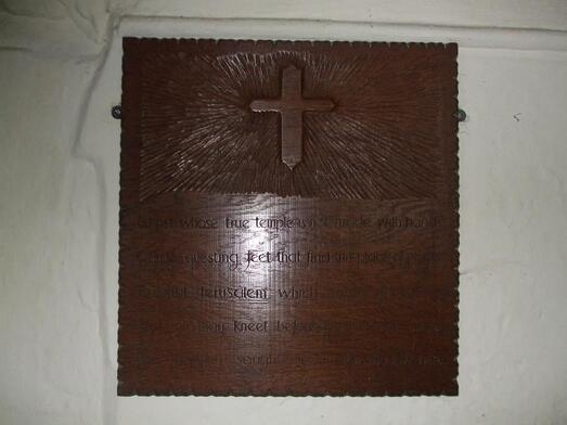wooden plaque on pew